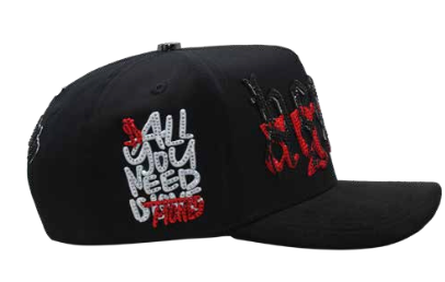 Men's black embroidered snapback cap, side angle view 3