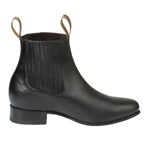 A black leather Chelsea-style ankle boot with a low block heel and pull loops at the collar, shown in a side profile on a white background.