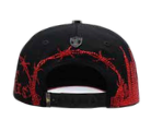 Men's black LA embroidered snapback cap, red underbrim detail