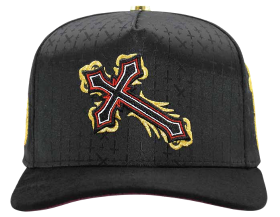 A black baseball cap featuring a large embroidered cross logo on the front, outlined in gold and red, with a subtle textured pattern across the crown.